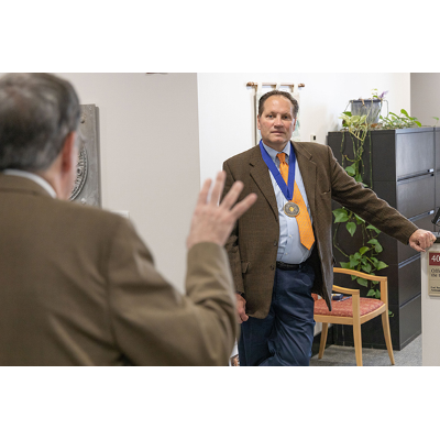 John Foley upon receiving a 2013 Chancellor's Award  for Excellence in Scholarship and Creative Activities.