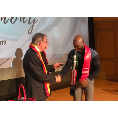 Student receiving Nigerian sash