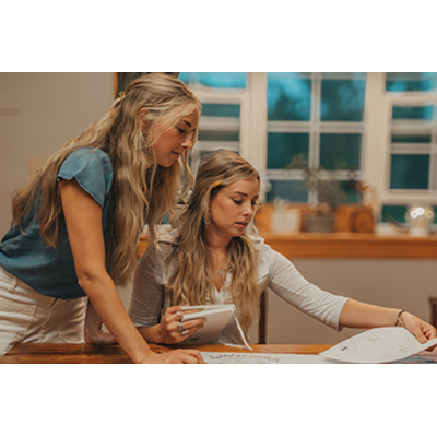 The Cino sisters proofing their manuscript