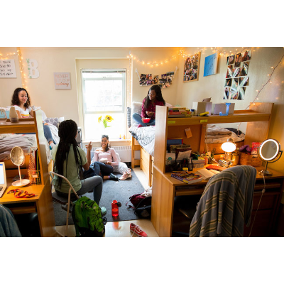 Students talking in bedroom