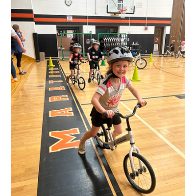 Kindergartner Hadlee Hines takes a bike ride