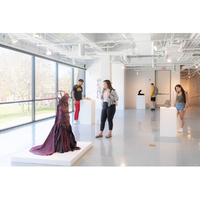 Students looking at sculptures in Dowd Gallery