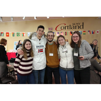 Spring 2019 - students with flag banner