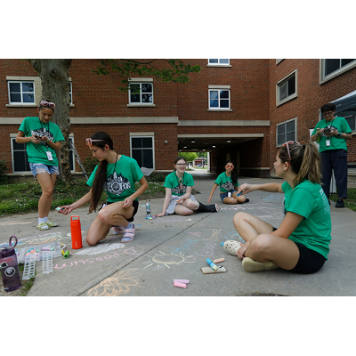 One team relaxes with a session sidewalk chalk