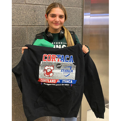 Alexa Villeck, winner of the Cortaca Sustainability Bingo challenge, posing with the prize.