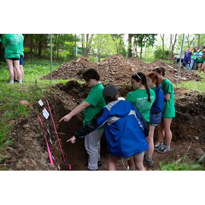 Young scholars read the soil near the Cortland Waterworks