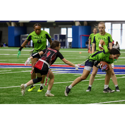 Red Dragon Cynthia Borschel tackles a Villa Maria player