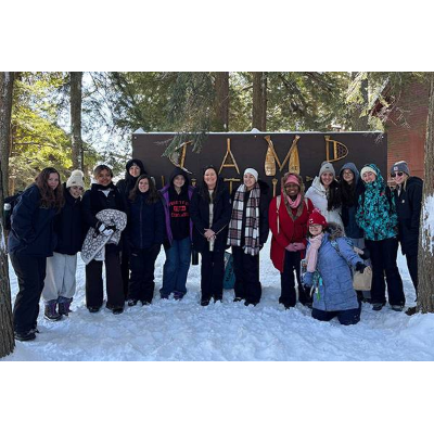Andersen, center, gathers with her class at winter camp