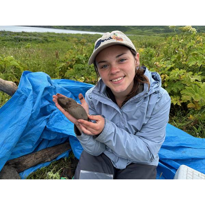 Sierra Polivka-Curri displays an Alaskan summer archaeological finding.
