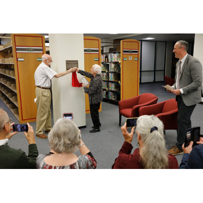 Couple unveils the Fralick Teaching Materials Center plaque