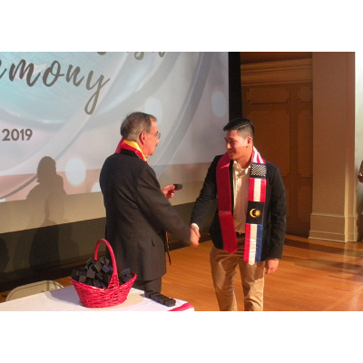Student receiving Malaysian sash