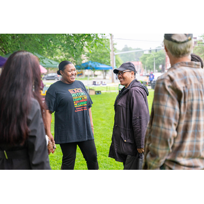 Friends share a chuckle at Juneteenth 2025