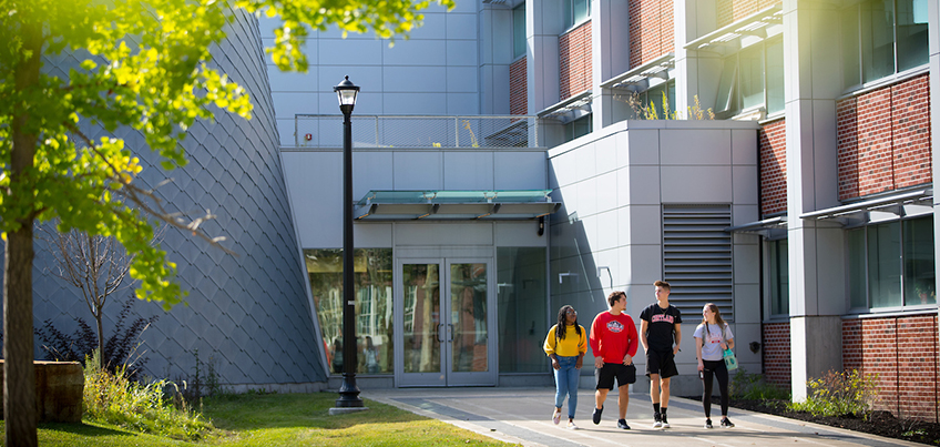 Students walking outside Bowers in the fall.