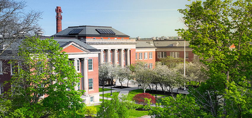 Wide exterior view of Old Main during the spring