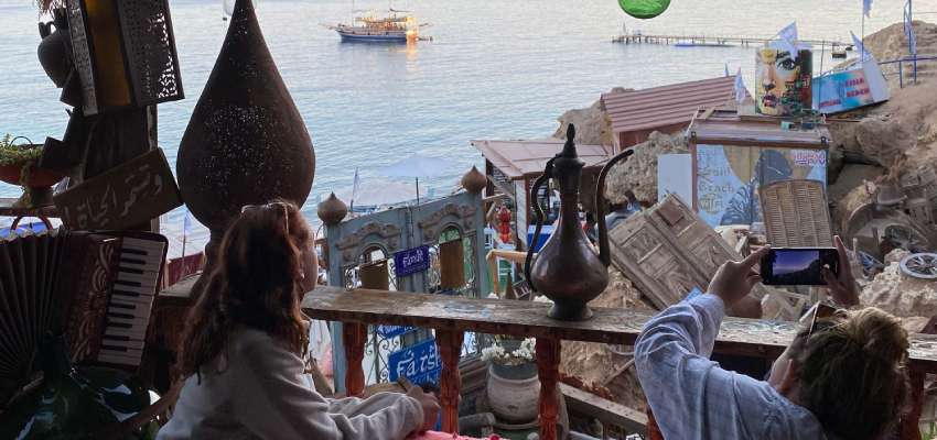 Students overlooking the Nile river from a balcony