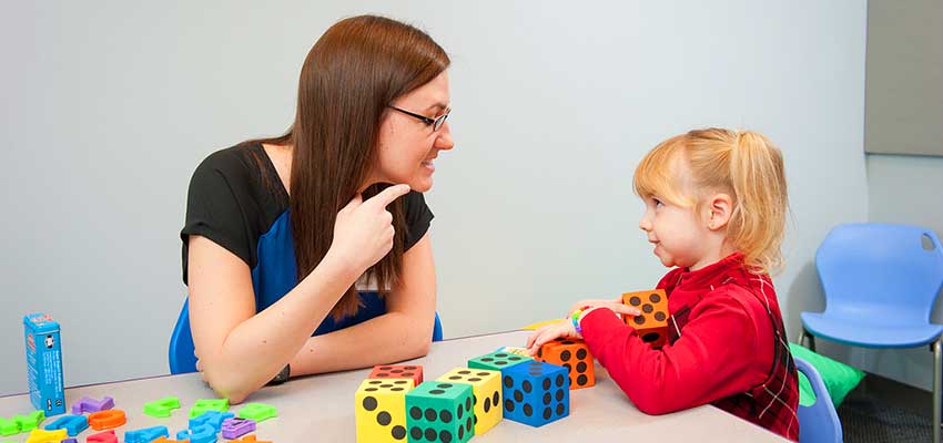 Speech and Hearing Science major getting hands-on experience working in a speech therapy and communication disorders clinic