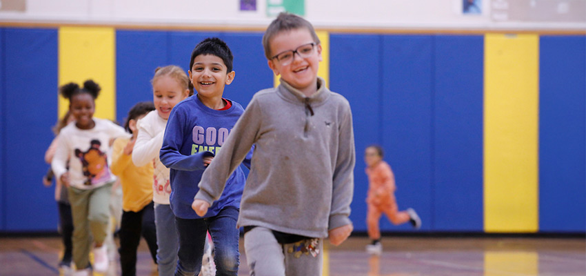 Children running in a gynmasium