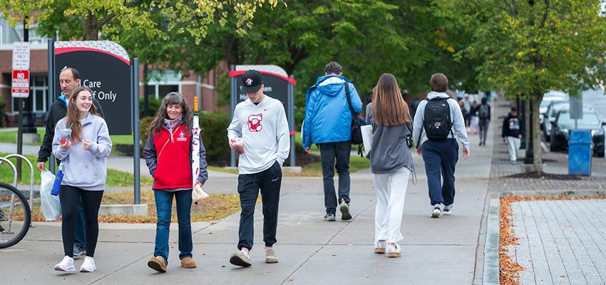 Prospective Family walking on campus at Open House