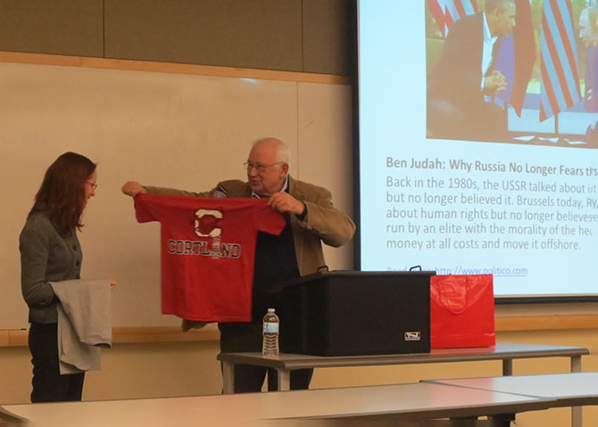 Prof. Henry Steck offers a Red Dragons gift to Ver Axyonova&nbsp;