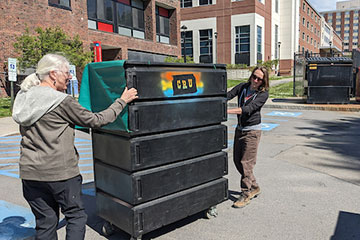 People moving Cortland ReUse bin
