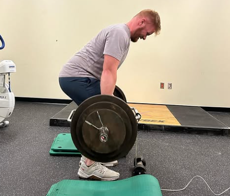 Student lifting weights