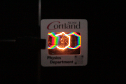 photo of the diffraction pattern from a incandescent bulb viewed from the end