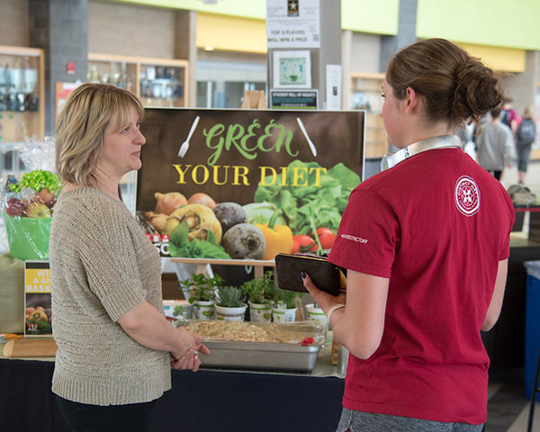 Student and dietician talking about plant-based foods