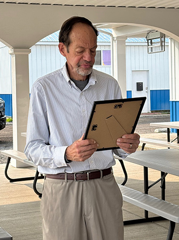 County Legislator Doug Bentley reads the proclamation.