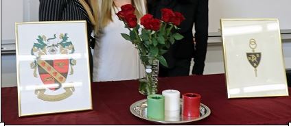 table decorations including tri beta logo, flowers and candles