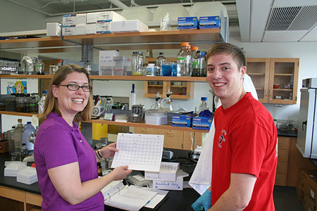 Dr. Chatfiled with Casey Peterson in her lab Dr. Chatfield with Casey Peterson in her lab.