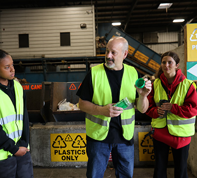 Chris Spadolini showing Green Reps what can be recycled