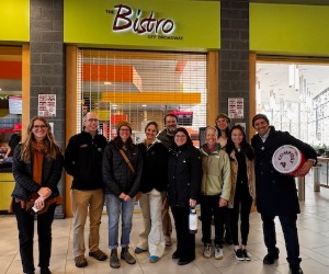 SUNY Cortland Green Ambassadors standing in front of Bistro on Broadway