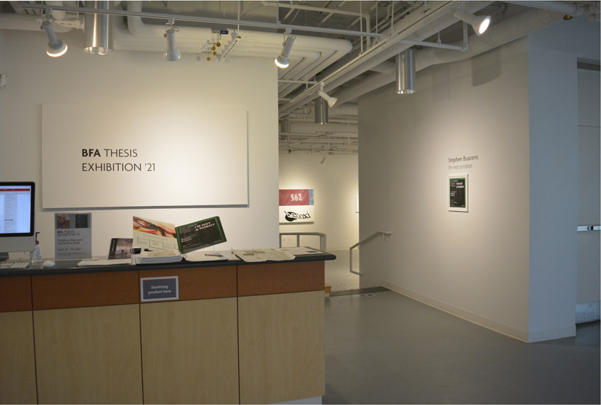 A view into the reception area and the west gallery featuring works by the BFA candidate Stephen Buscemi.