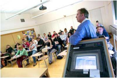 Economics professor teaching to a small class