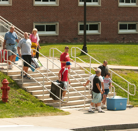 Students and their families climb the stairs to the hall. Stairs at Alger Hall
