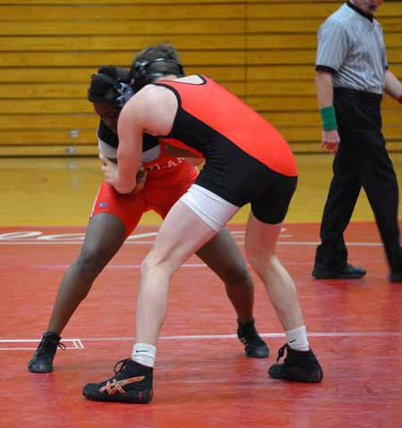 College's first female varsity team wrestler Nyassa "Tiny" Bakker (on left)
