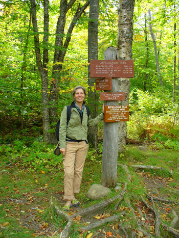 Joan Maloof poses in a favorite place Joan Maloof in the woods