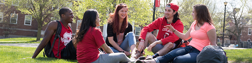 Students sitting on the lawn outside of Moffett Center