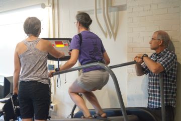 Study participant riding QuadMill